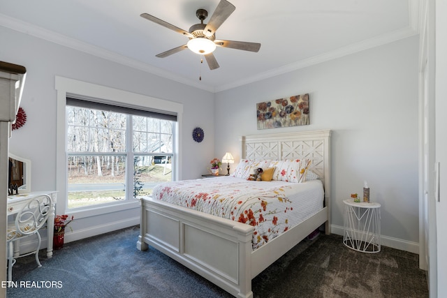 bedroom with crown molding, dark carpet, and ceiling fan