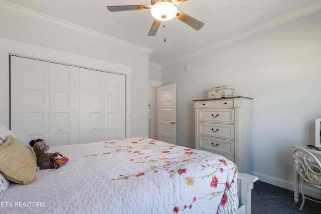 bedroom featuring crown molding, ceiling fan, dark carpet, and a closet