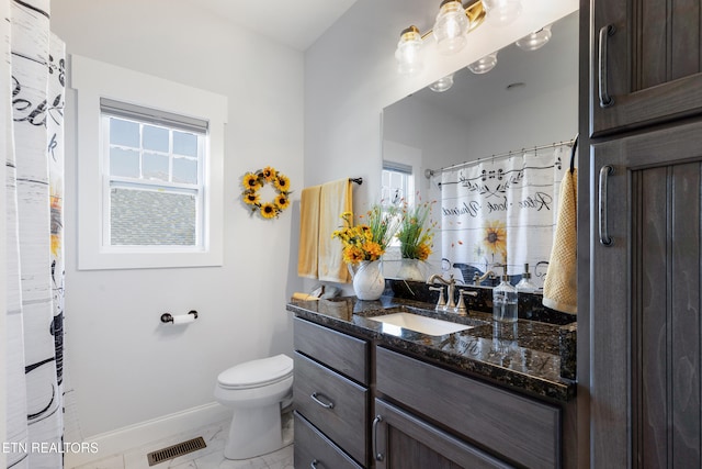 bathroom with vanity and toilet