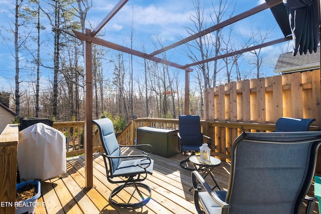 wooden terrace with area for grilling