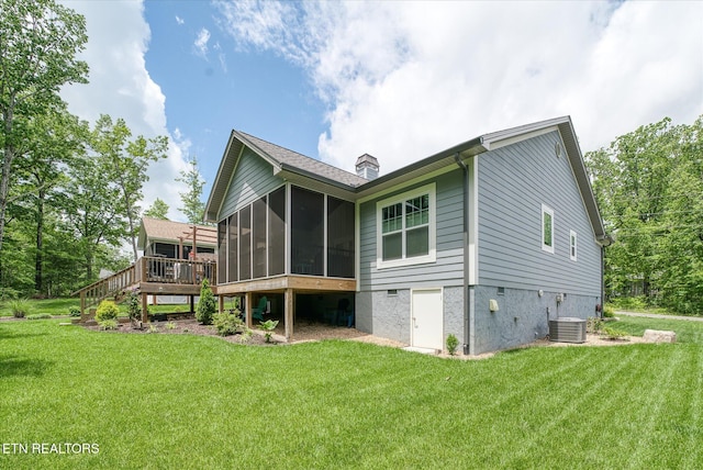 197 Cappshire Rd, Crossville, TN 38558 - rear view of house with a sunroom, a chimney, and a yard