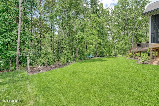 197 Cappshire Rd, Crossville, TN 38558 - view of grassy yard with stairs, a sunroom, and a deck