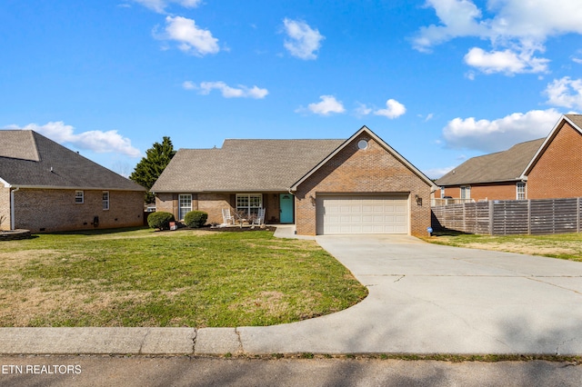 ranch-style house featuring a garage and a front lawn