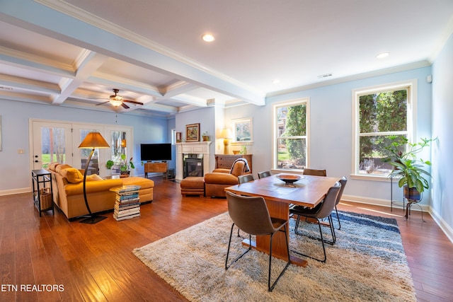 dining room featuring visible vents, baseboards, beamed ceiling, hardwood / wood-style flooring, and coffered ceiling