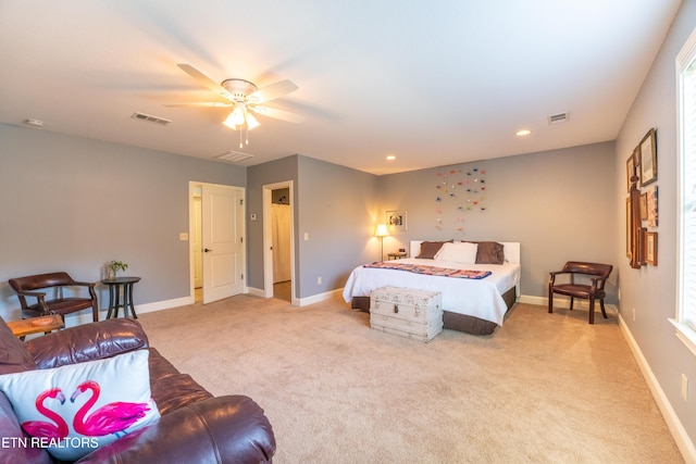 bedroom with light carpet, visible vents, ceiling fan, and baseboards