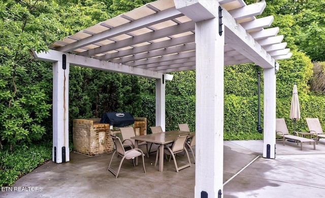 view of patio featuring outdoor dining area and a pergola