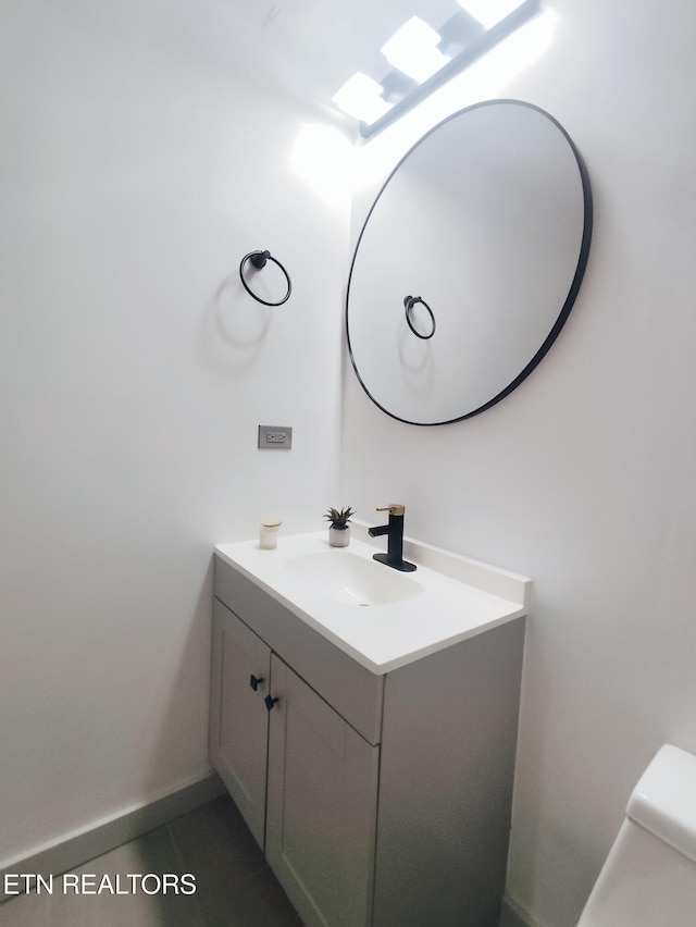 bathroom with vanity and toilet