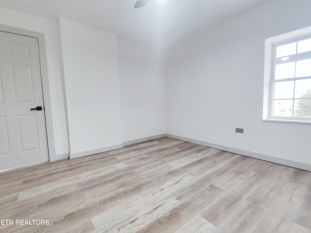 spare room featuring ceiling fan and light hardwood / wood-style floors