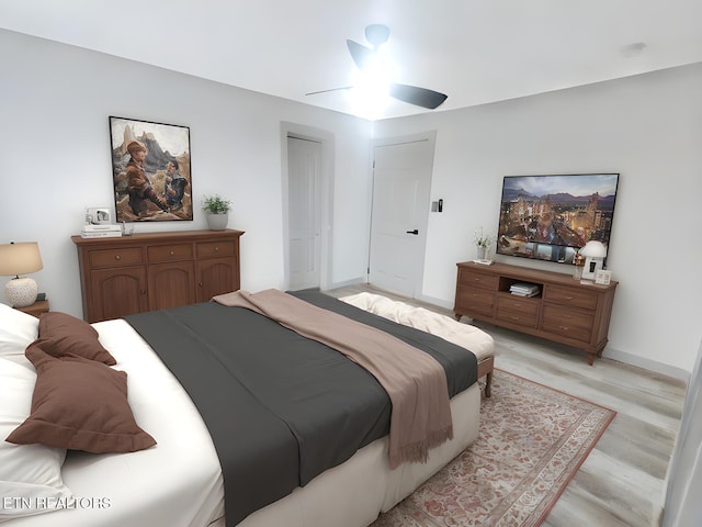 bedroom featuring ceiling fan and light hardwood / wood-style flooring