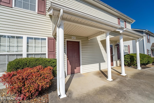 view of exterior entry with covered porch