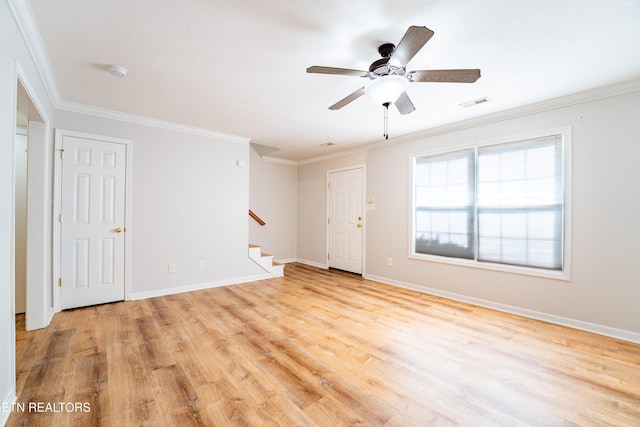 empty room with crown molding, ceiling fan, and light hardwood / wood-style flooring