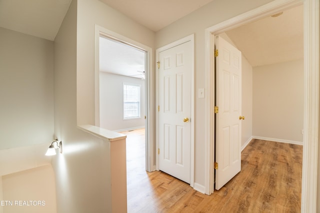 hallway with light wood-type flooring