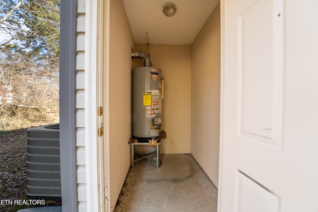 utility room featuring water heater