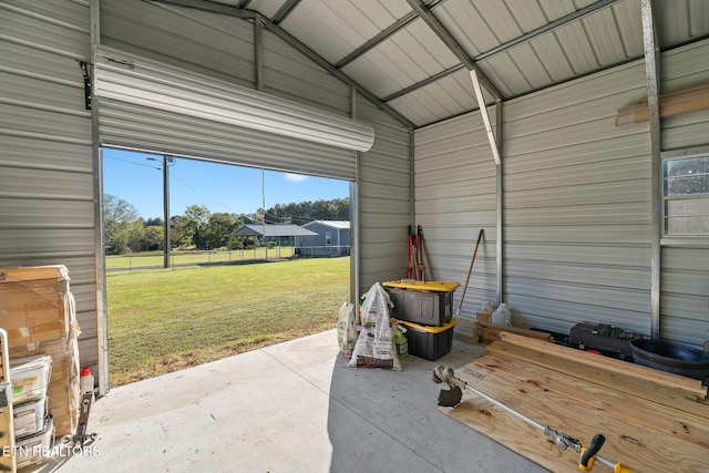 garage featuring a yard