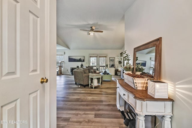 entrance foyer with lofted ceiling, hardwood / wood-style floors, and ceiling fan