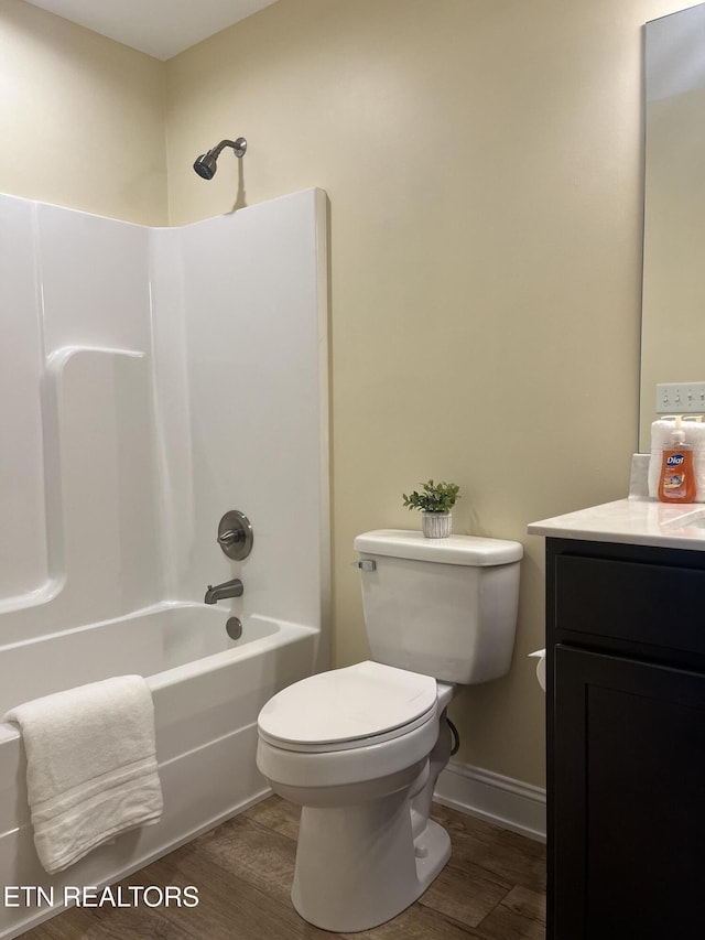 full bathroom with vanity, toilet, shower / bath combination, and hardwood / wood-style floors