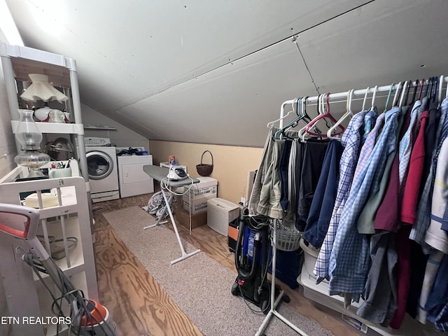 spacious closet with separate washer and dryer and lofted ceiling