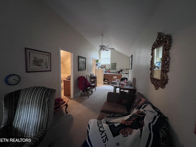 carpeted living room with ceiling fan and vaulted ceiling