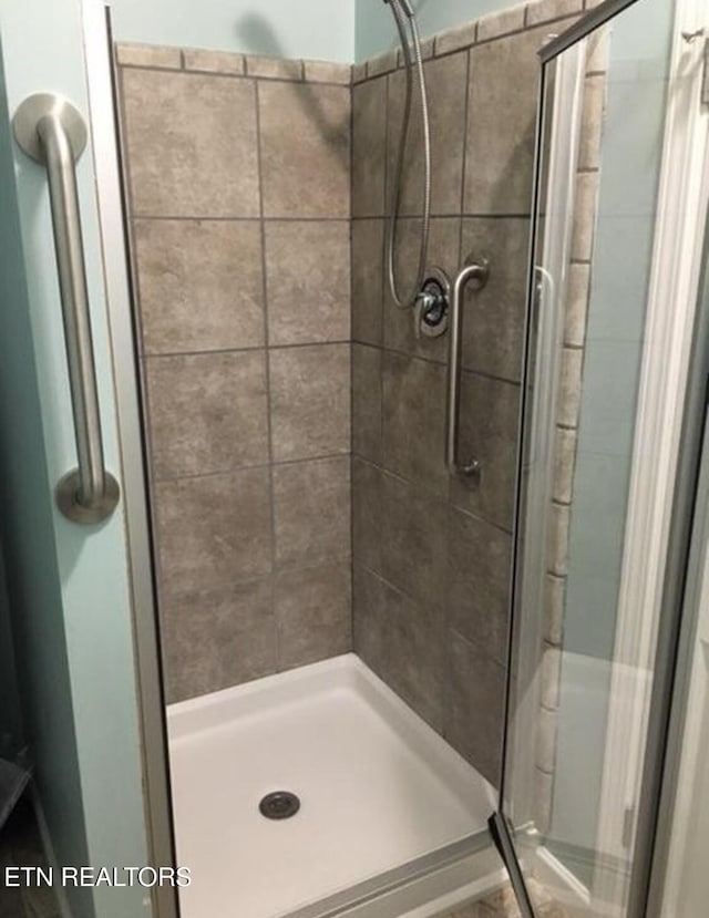 bathroom with a stall shower