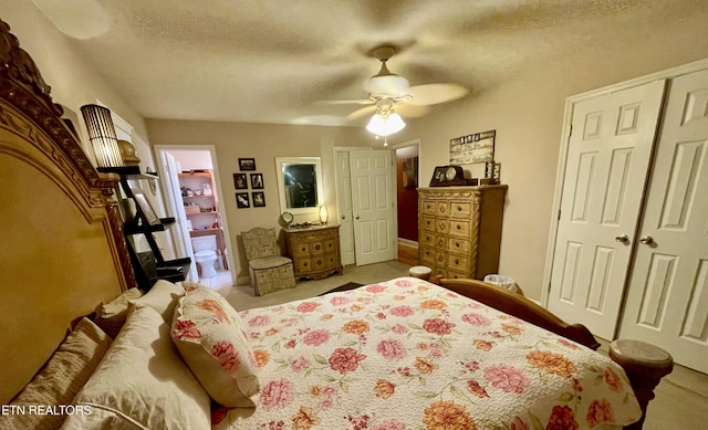 bedroom with ceiling fan, a textured ceiling, and a closet