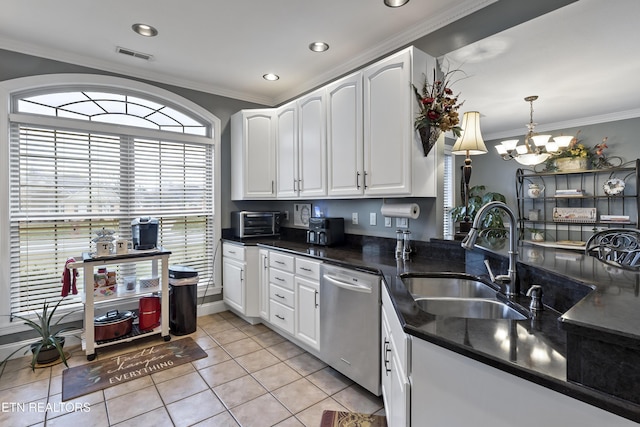 kitchen featuring light tile patterned floors, a sink, white cabinets, ornamental molding, and dishwasher