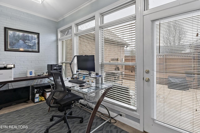 home office featuring brick wall and crown molding