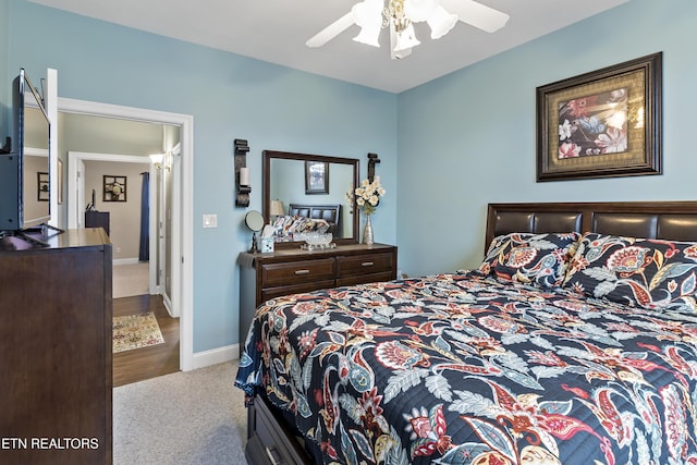 carpeted bedroom featuring ceiling fan and baseboards