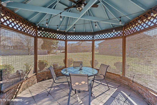 view of patio featuring a ceiling fan, outdoor dining area, and a gazebo