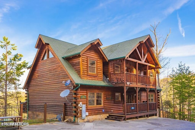 exterior space featuring a porch and a balcony