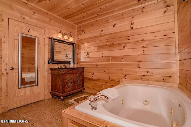 bathroom with vanity, a bathing tub, tile patterned flooring, and wood walls