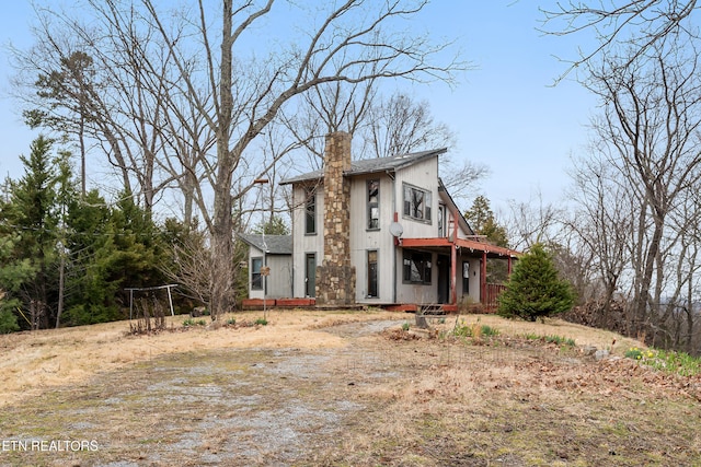 view of front of home with a chimney