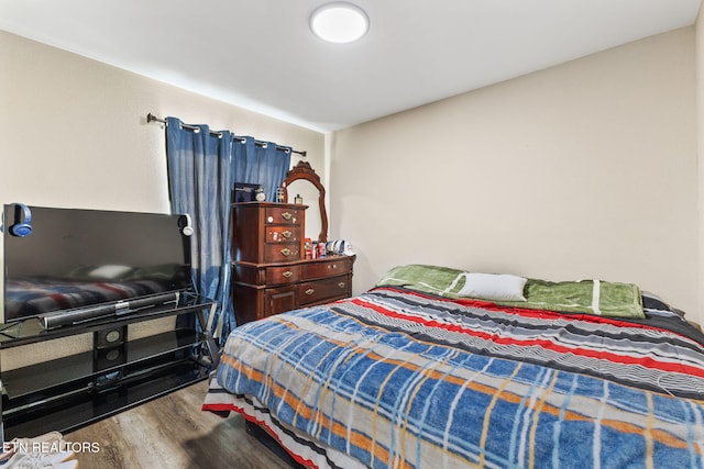 bedroom featuring wood-type flooring