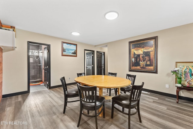 dining space featuring light hardwood / wood-style flooring