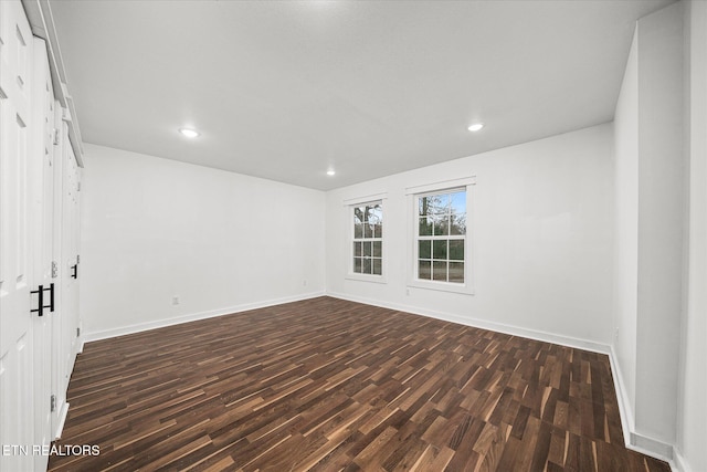 unfurnished room featuring dark hardwood / wood-style floors