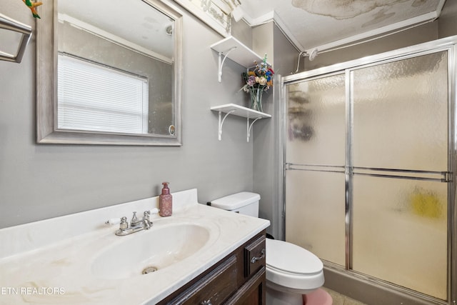 bathroom featuring vanity, toilet, and walk in shower