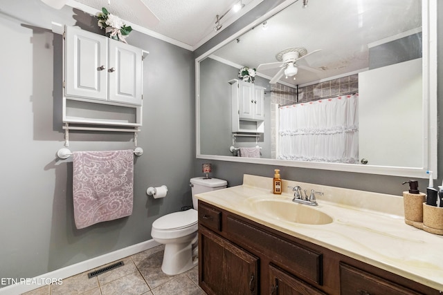 bathroom with ornamental molding, vanity, ceiling fan, toilet, and tile patterned floors