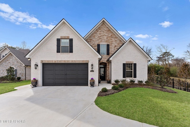 view of front property with a garage and a front yard