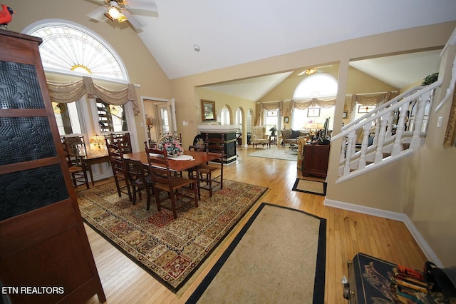 3413 Commodore Pt, Knoxville, TN 37922 - dining area featuring a ceiling fan, high vaulted ceiling, wood finished floors, and baseboards