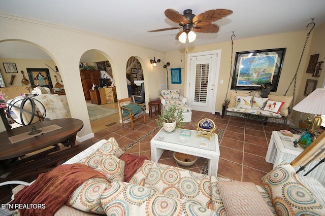 3413 Commodore Pt, Knoxville, TN 37922 - living area featuring arched walkways, tile patterned flooring, a ceiling fan, and baseboards