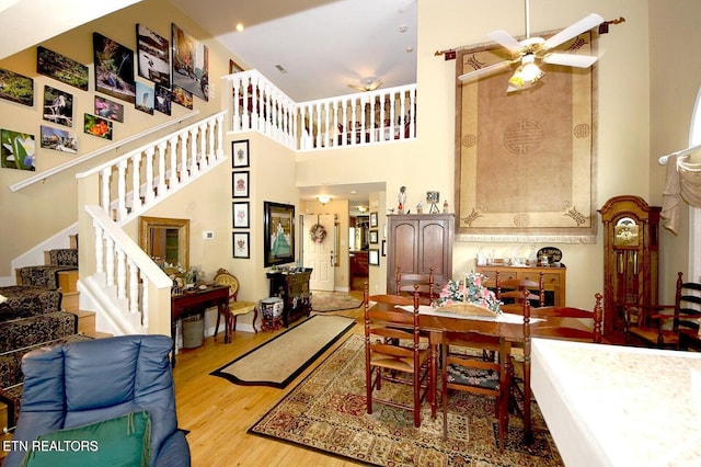 3413 Commodore Pt, Knoxville, TN 37922 - dining area with a high ceiling, a ceiling fan, wood finished floors, and stairway