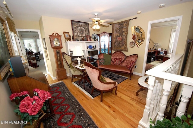 3413 Commodore Pt, Knoxville, TN 37922 - living area with light wood finished floors, ceiling fan, and baseboards