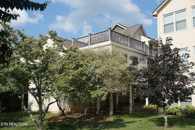3413 Commodore Pt, Knoxville, TN 37922 - view of side of property with a balcony, stucco siding, and a yard