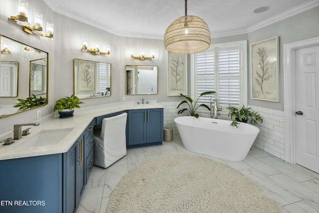 bathroom featuring marble finish floor, a soaking tub, vanity, and crown molding