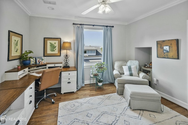 office area with ornamental molding, dark wood finished floors, a ceiling fan, and baseboards