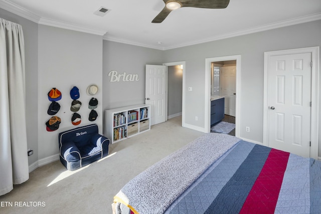 bedroom with carpet floors, crown molding, visible vents, ensuite bathroom, and baseboards