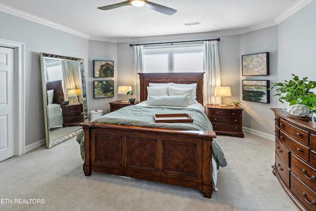 bedroom with light carpet, visible vents, and crown molding