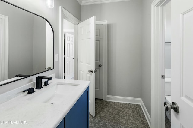 bathroom with vanity and baseboards