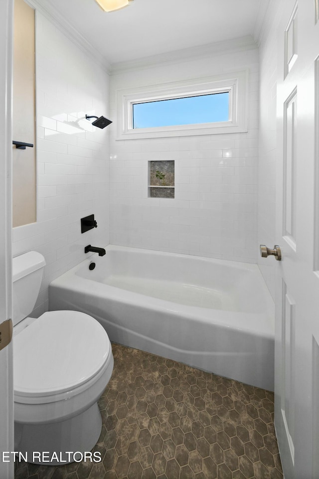 full bath featuring washtub / shower combination, crown molding, and toilet