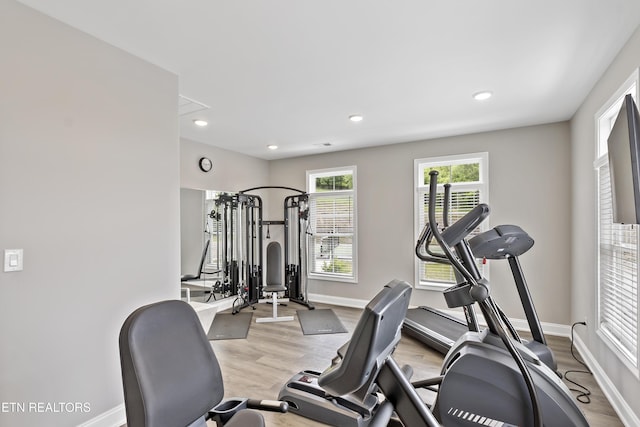 workout area featuring light hardwood / wood-style floors