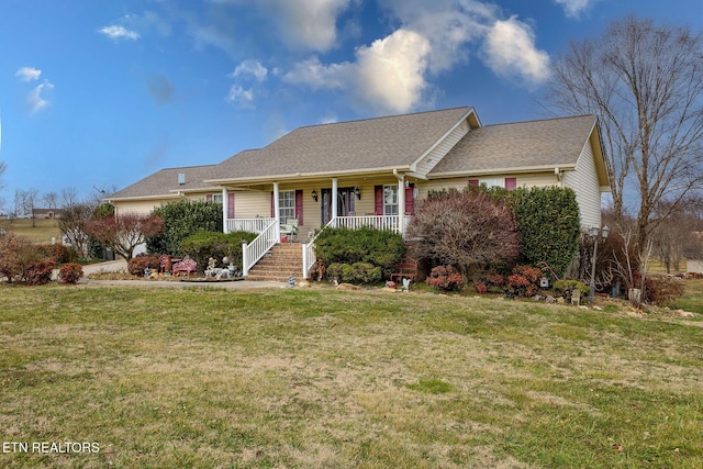 single story home with covered porch and a front yard